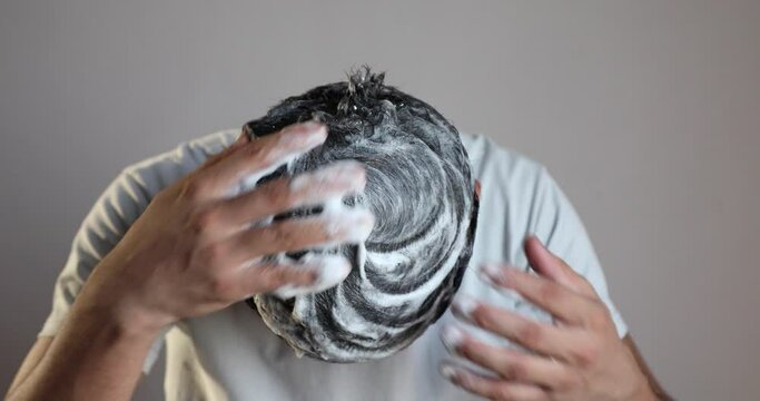 Man Cleaning His Hair With A Anti Dandruff Shampoo Foam, Using Hair Care Product