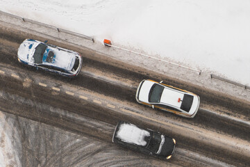 Top view of the roadway in winter. Cars in soft motion.