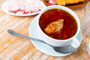 Traditional dish of Slavic cuisine called Borsch, cooked in meat broth from beets, cabbage, potatoes, carrots and onions
