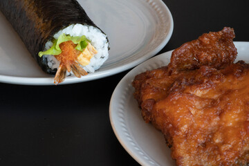 Sushi roll and fish fry