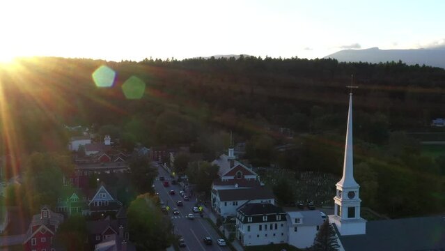 Aerial drone footage of the town of Stowe, Vermont, with a beautiful church.  