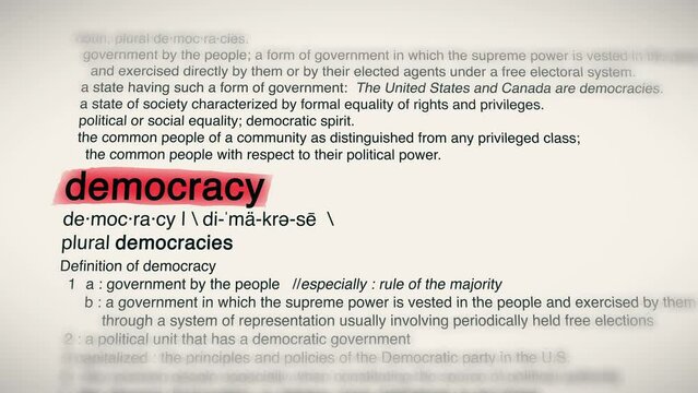 The Word Democracy Red Highlighted in a Dictionary Animation