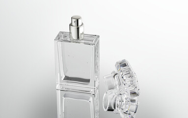 30-50 ml. Perfume container, clear glass sprayer dispenser bottle. Nice geometric clear plastic cover style with uncovered. top view 45 degrees. 