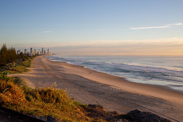 Coastline Golden Sunrise with Buildings and Surf Beach