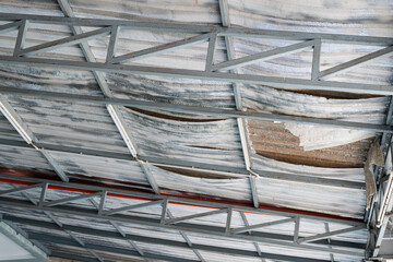 Polyethylene foam expires of metal sheet roof. - obrazy, fototapety, plakaty