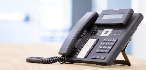Close up telephone landline at office concept Communication support, call center and customer...