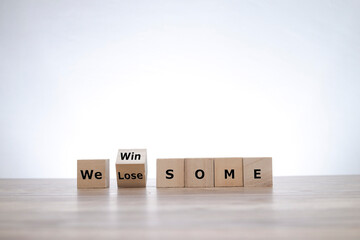 Wooden blocks with WIN SOME LOSE SOME wordings. Business concept 