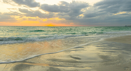 Obraz premium Reflection of Sunset on North Lido Key Beach, Sarasota, Florida, USA