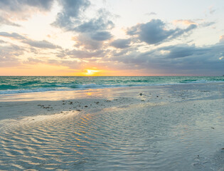 Obraz premium Reflection of Sunset on North Lido Key Beach, Sarasota, Florida, USA