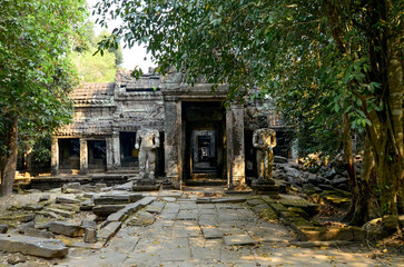 Fototapeta na wymiar Cambodia, ANGKOR Temple complex, Preah Khan temple (Preah Khan Kampongsvai) in the rainforest, Entrance to the Cambodian temple, columns, headless Statues, Religious structure of the Angkor period