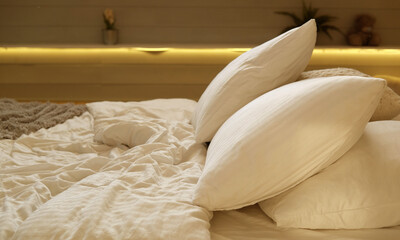 bed in the bedroom, white pillows and cozy linens