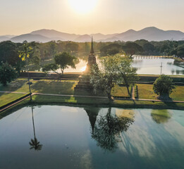 Fototapeta na wymiar Aerial view of Wat Mahathat buddha and temple in Sukhothai Historical Park