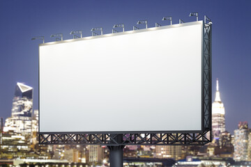 Blank white horizontal billboard on city buildings background at night, perspective view. Mockup, advertising concept