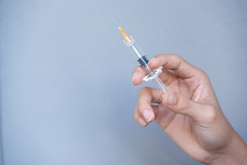 The syringe in the hands of the experts is ready to use.