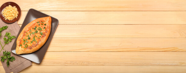 Tasty Turkish Pizza on wooden background with space for text