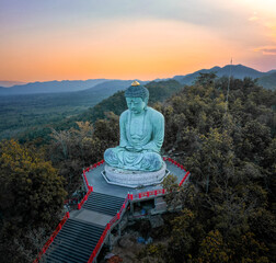 Fototapeta premium Aerial view of Wat Doi Prachan Mae Tha or Wat Phra That Doi Phra Chan in Lampang, Thailand