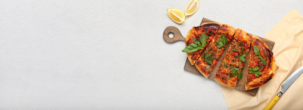 Tasty Turkish Pizza on light background with space for text