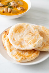 Chicken curry soup with roti