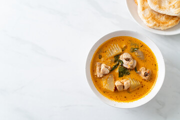 Chicken curry soup with roti