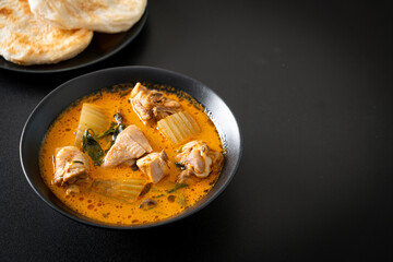 Chicken curry soup with roti