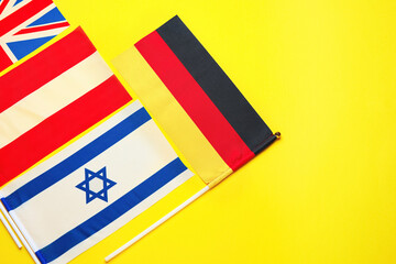 Flags of Germany, Great Britain, Austria and Israel on color background, closeup