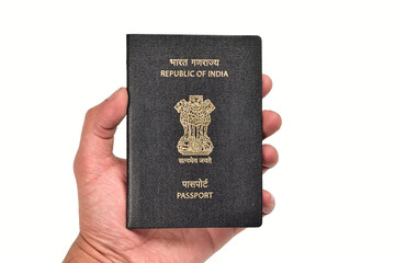 Indian Passport in Hand Isolated on White Background with Clipping Path