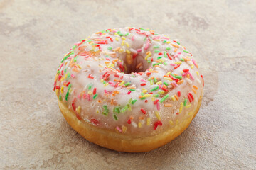 Sweet glazed vanilla donut with icing