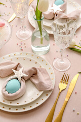 Festive table setting for Easter celebration on light background