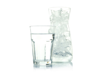 Jug with ice and glass of water isolated on white background