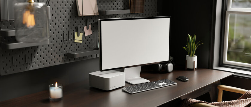 Modern stylish home workspace interior with computer mockup on dark wood table