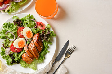 Healthy breakfast menu, A plate of roasted chicken breast with fresh salad
