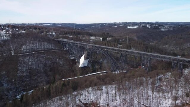 Aerial view of popular landmark in Germany. High Mungstener railway bridge construction in snowy winter.