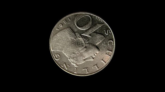 Rotating reverse of Austria coin 10 schilling 1981. Isolated in black background.