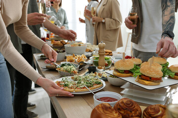 People near buffet table with food indoors, closeup. Brunch setting