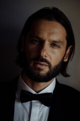 Obraz premium Elegant young handsome man. Fashion portrait studio.