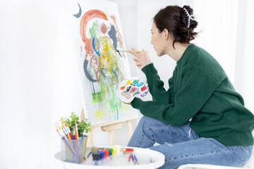 Female artist painting on canvas, Artist studio interior, Draw with watercolor, Drawing supplies ,...