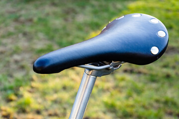 close up saddle and post of fixed gear bike, old vintage bicycle