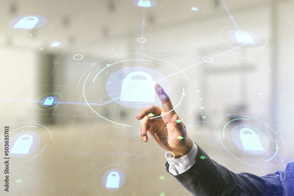 Poster developer's hand clicks on virtual creative lock illustration with microcircuit on blurred office ba