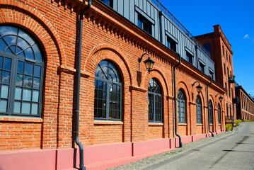 Fototapeta na wymiar historic spinning mill factory built in 1872, after revitalization it houses modern loft apartments, Ksiezy Mlyn, Tymienieckiego street, Lodz, Poland, Europe