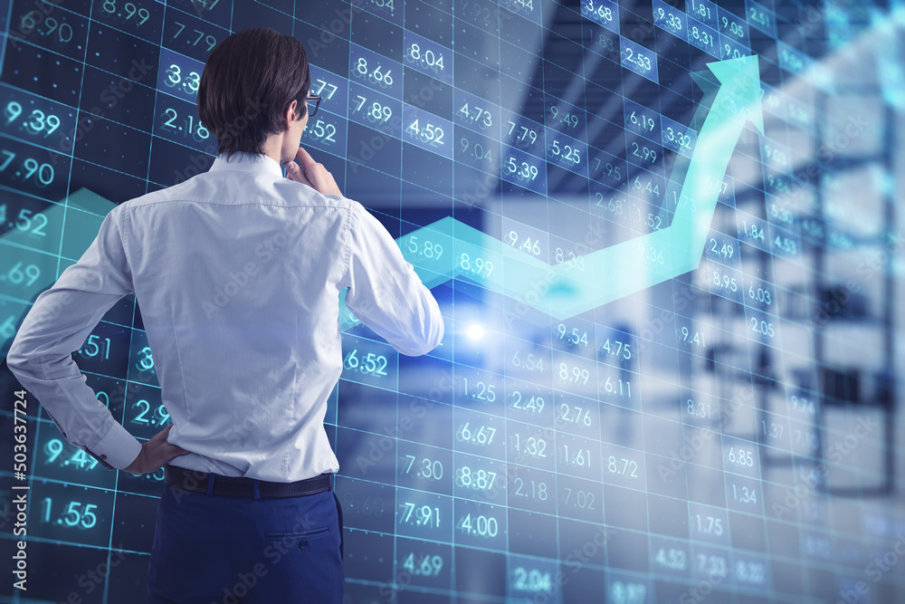 Poster businessman standing in office interior with creative digital financial numbers or index data on blu