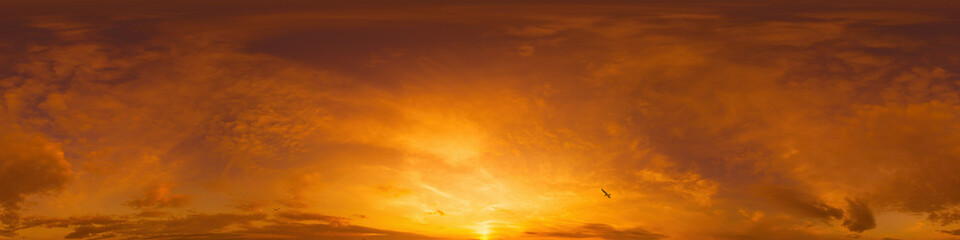 Dramatic sunset sky panorama with Cumulus clouds. Seamless hdr 360 pano in spherical...