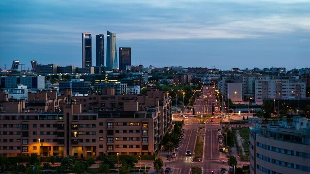 Timelapse at sunset of Madrid Skyline and the Four Tower 