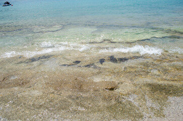 Oludeniz Beach, which is famous for its sandy beach and blue sea, is where paragliders jumping from Babadag land.