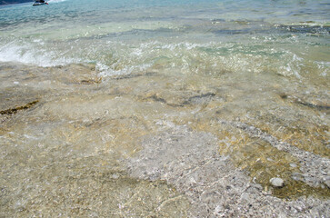 Oludeniz Beach, which is famous for its sandy beach and blue sea, is where paragliders jumping from Babadag land.