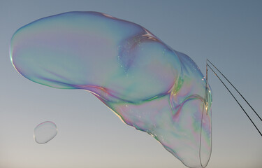 Huge bubbles. Blowing big soap bubbles in the air. Freedom, summer concepts.