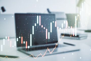 Abstract creative financial graph on modern laptop background, forex and investment concept. Multiexposure