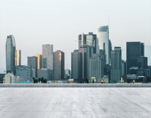 Empty concrete dirty rooftop on the background of a beautiful Los Angeles city skyline at daytime, mockup
