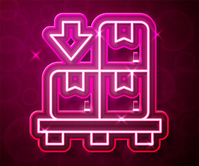 Glowing neon line Cardboard boxes on pallet icon isolated on red background. Closed carton delivery packaging box with fragile signs. Vector