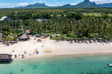 Aerial view of Flic en Flac beach from above, palm trees and umbrellas, Mauritius, Africa