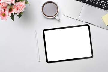 Mock up digital tablet, notepad, stylus pen and wireless on white office desk.